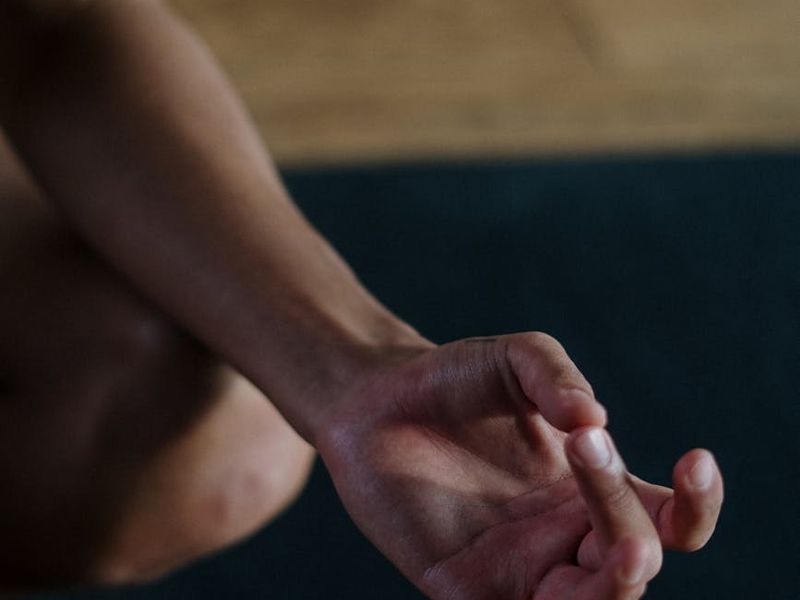 Detailed view of hands in a yoga mudra position
