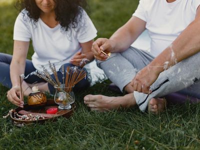 Incense sticks burning on a tray