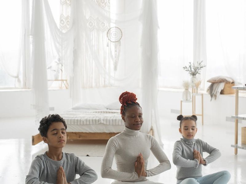 Minimalist light-filled room prepared for yoga practice